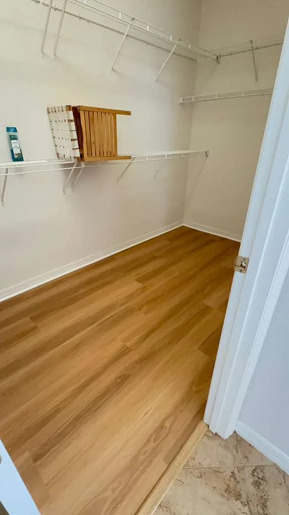 Walk-in closet cleaned by Lima Cleaning Services